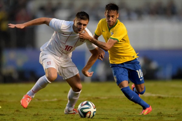 Neymar getting past a Serbian defender