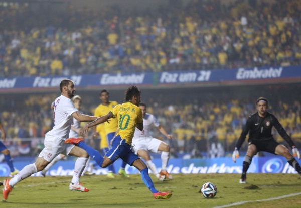 Neymar preparing to strike the ball with his right foot