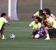 Neymar helps a pitch invader kid meeting the Brazilian Team