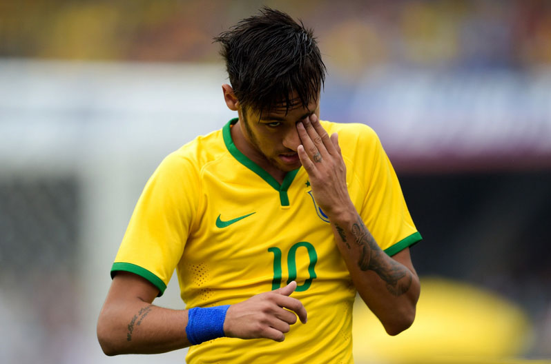 Neymar scratching his eye in Brazil