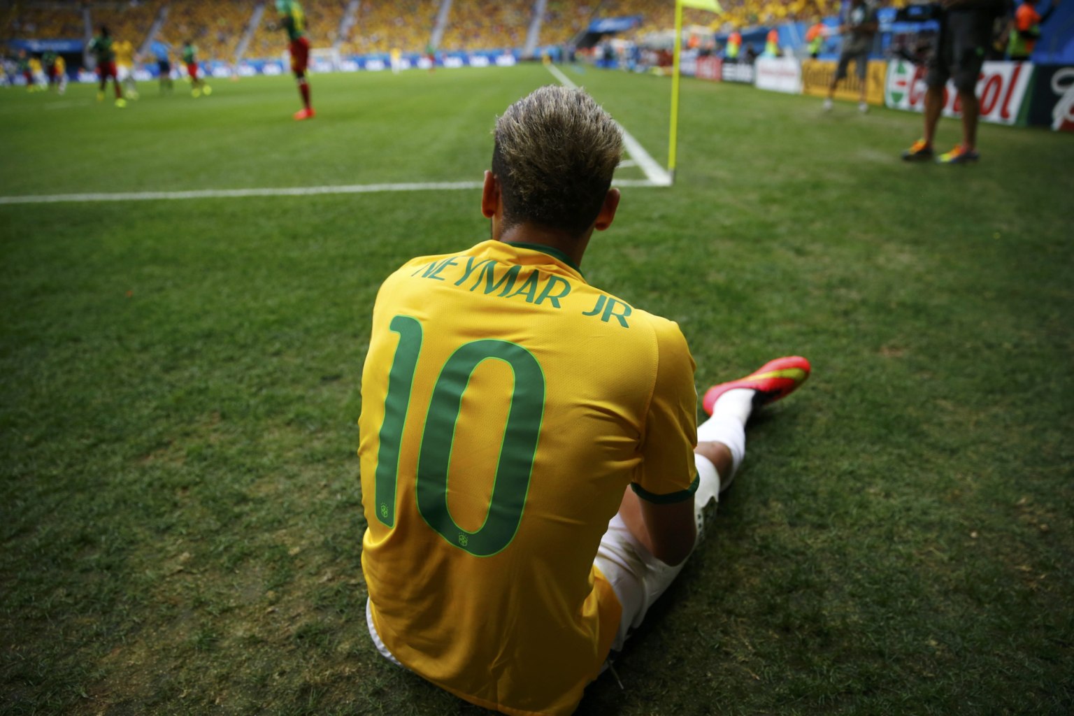 Neymar sitting on the ground, at the FIFA World Cup 2014