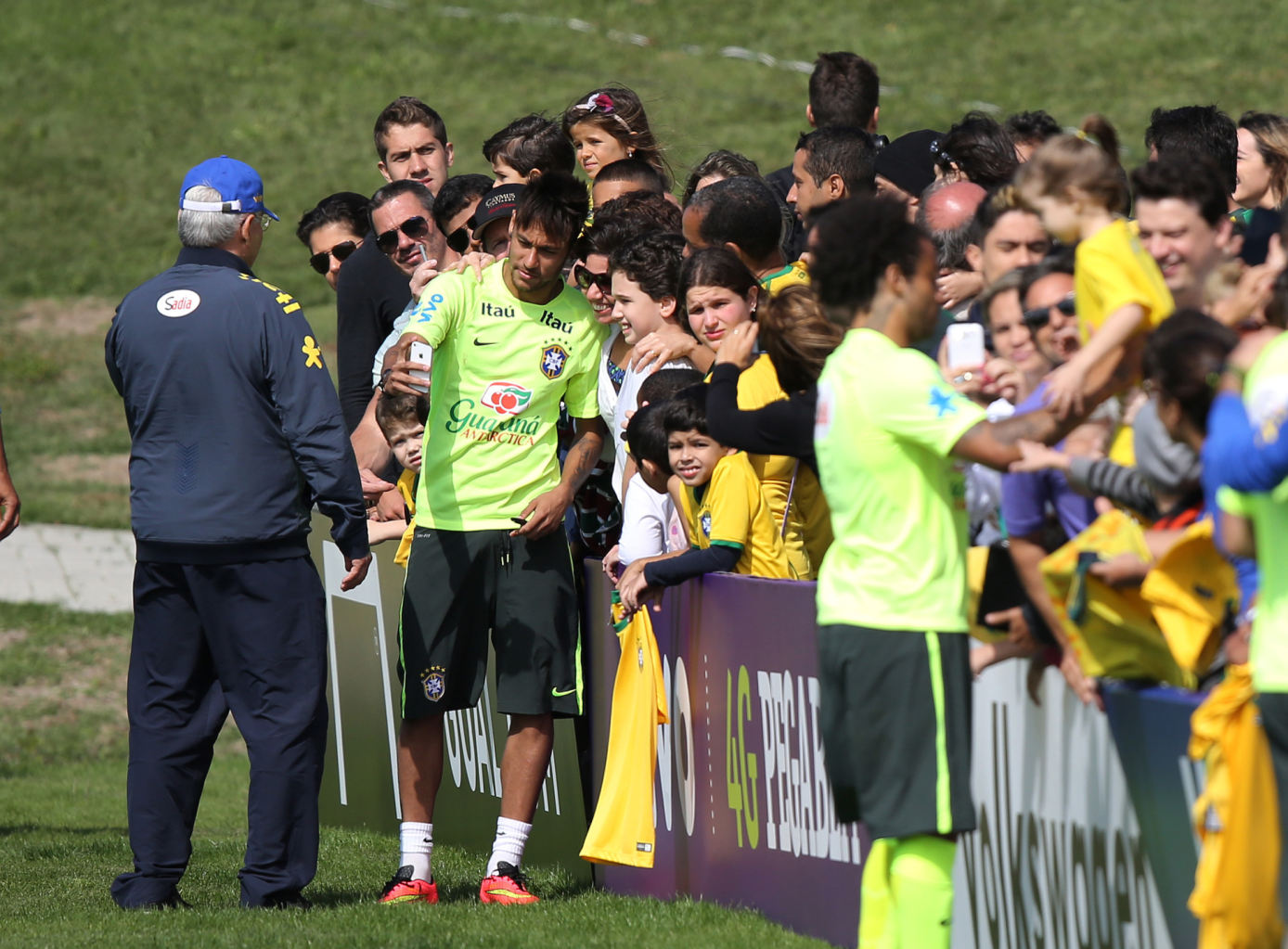 Neymar taking photos with Brazilian fans