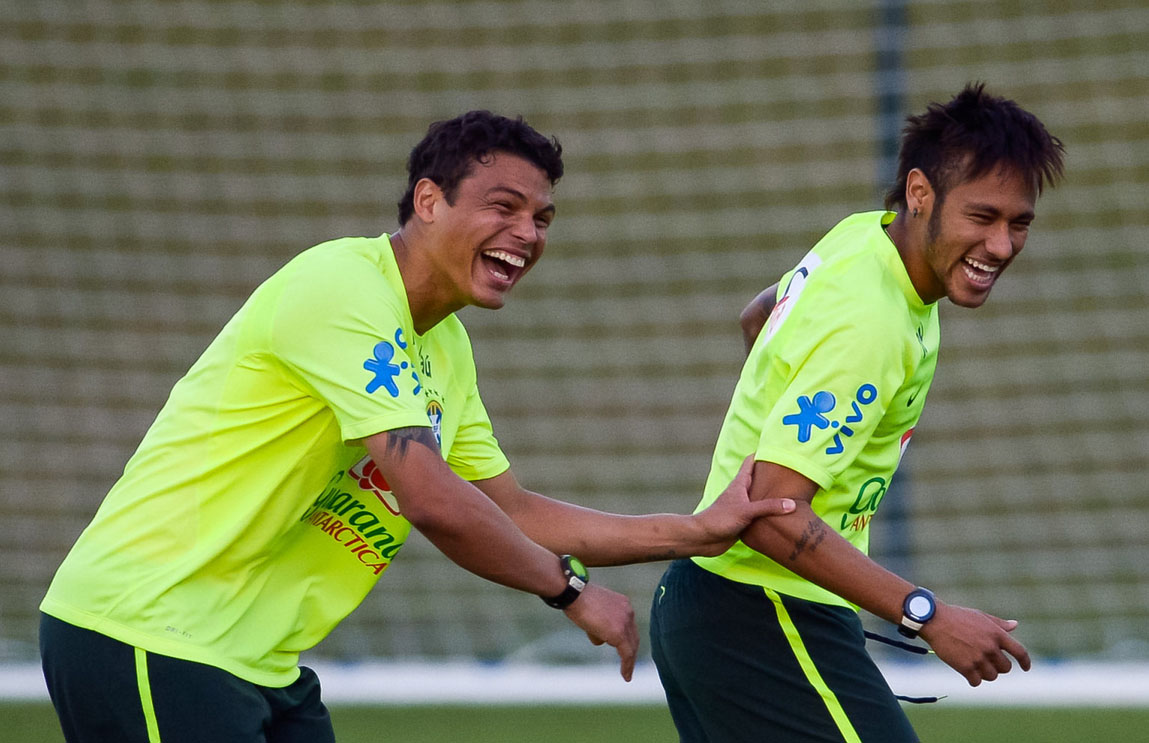 Thiago Silva and Neymar playing around and laughing, in Brazilian Team practice