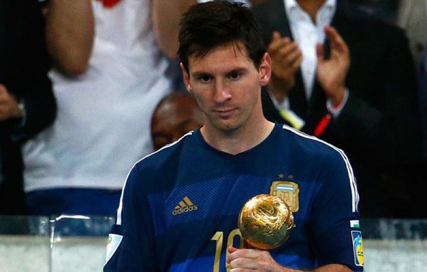 Lionel Messi holding the FIFA World Cup Ballon d'Or 2014
