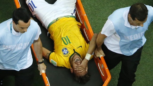 Neymar carried away off the pitch on a stretcher, after his back injury