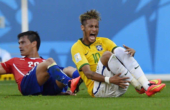 Neymar holding to his ankle, in the FIFA World Cup 2014