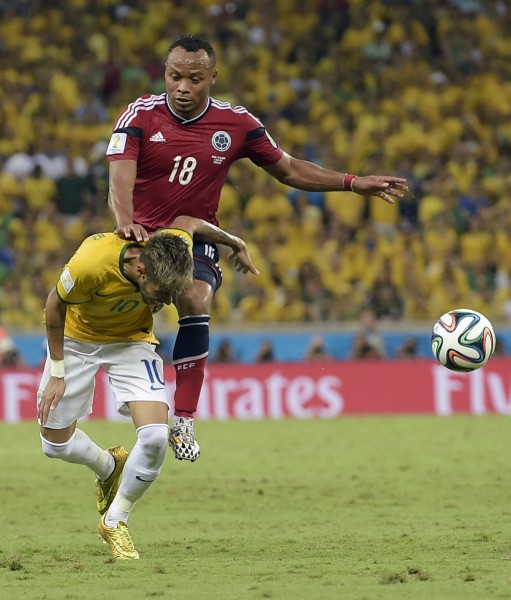 Zuniga injuring Neymar with his knee, in the FIFA World Cup 2014 game between Brazil and Colombia