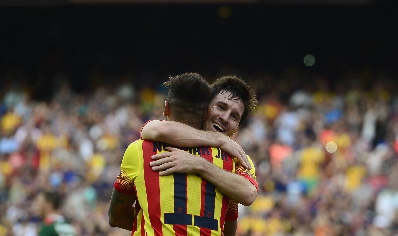 Lionel Messi hugging Neymar Jr