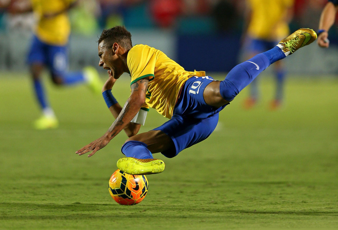 Neymar falling to the ground after being fouled