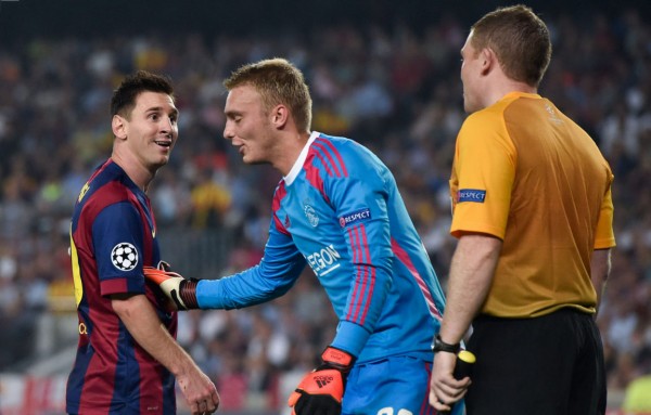 Lionel Messi laughing at the referee