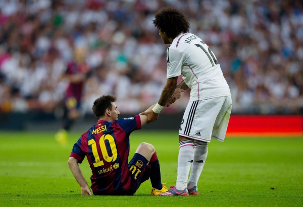 Marcelo helping Messi to stand up, in a La Liga Clasico
