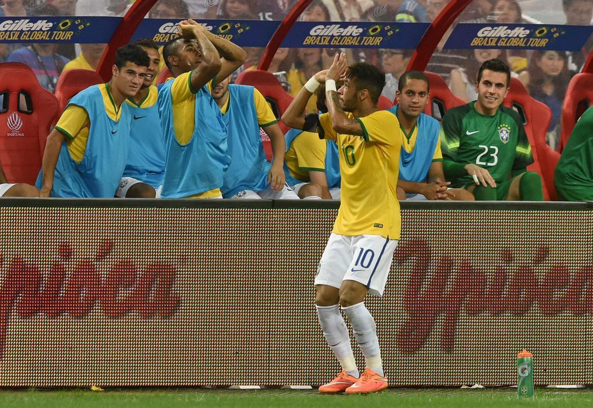 Neymar celebrating a goal with a 3-point basketball throw gesture