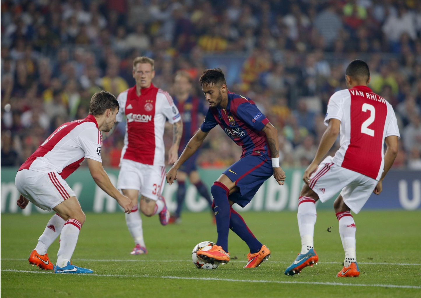 Neymar surrounded by Ajax defenders