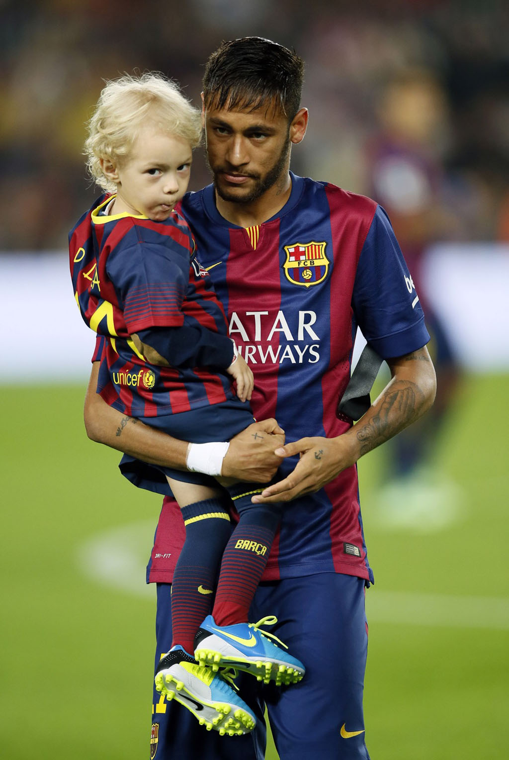Neymar holding his son in his arms