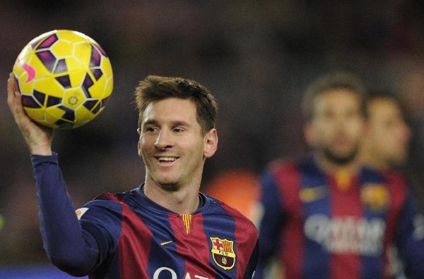 Lionel Messi holding his hat-trick match ball, in Barcelona 5-1 Espanyol