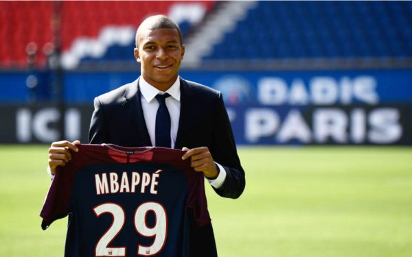 Kylian Mbappé with his PSG jersey