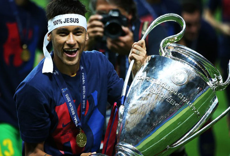 Neymar holding the Champions League trophy